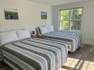 Postel nebo postele na pokoji v ubytování Kingfisher Lodging