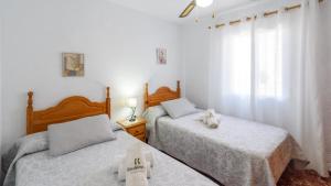 A bed or beds in a room at Villa José Andrés Torrox by Ruralidays Még 22 kép
