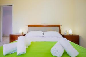 A bed or beds in a room at Pano's House