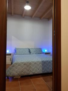 Casa Mariella tesisinde bir odada yatak veya yataklar