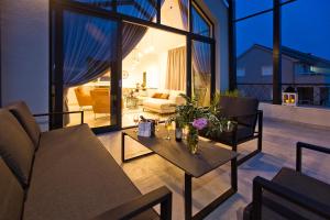 a living room with a couch and a table at La Siesta - ZF Hvar in Hvar