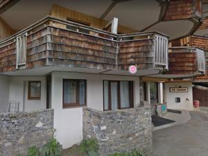 a house with a large deck on top of it at Appartement Avoriaz, 4 pièces, 8 personnes - FR-1-633-43 in Morzine