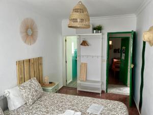 A bed or beds in a room at Pensión Playa
