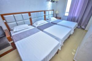 Postel nebo postele na pokoji v ubytování Hotel Chveni Sakhli