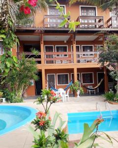 a view of the hotel from the pool at Pousada Miramar in Marataizes