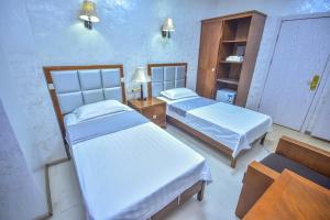 Postel nebo postele na pokoji v ubytování Hotel Chveni Sakhli