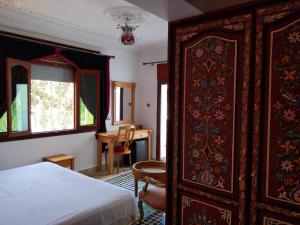Ένα ή περισσότερα κρεβάτια σε δωμάτιο στο Malabata Guest House