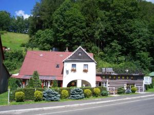 a small white house with a red roof at Ubytování Riegel in Svoboda nad Úpou