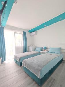 SOVA smart HOUSE tesisinde bir odada yatak veya yataklar