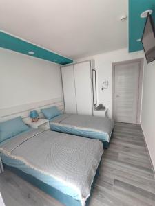 SOVA smart HOUSE tesisinde bir odada yatak veya yataklar
