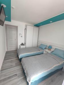 SOVA smart HOUSE tesisinde bir odada yatak veya yataklar