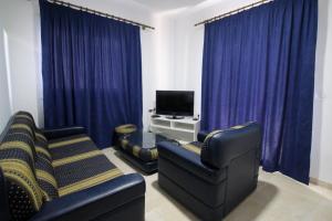 TV a/nebo společenská místnost v ubytování Hotel Vila Kapllani