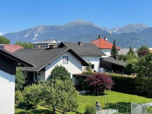 a group of houses with mountains in the background at Apartment ANMARI in Radovljica