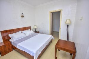 Postel nebo postele na pokoji v ubytování Hotel Chveni Sakhli