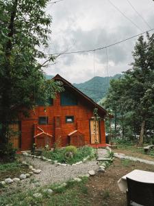 a wooden house in the middle of a forest at Kiana Bungalov in Ardeşen