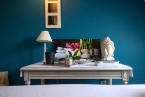 Postel nebo postele na pokoji v ubytování Tulip Inn Honfleur Residence & Spa