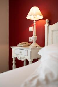 Postel nebo postele na pokoji v ubytování Tulip Inn Honfleur Residence & Spa