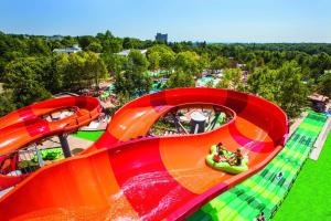 a ride at an amusement park with people on it at Hotel PrimaSol Ralitsa Superior in Albena