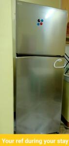 a stainless steel refrigerator in a kitchen at Soc Transient House by GPR in Baguio