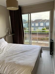 Posteľ alebo postele v izbe v ubytovaní Appartement avec terrasse vue mer 50 mètres de la plage