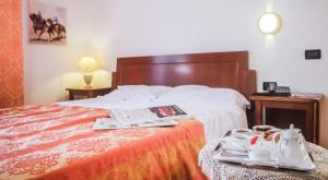 Voodi või voodid majutusasutuse Hotel Il Querceto toas