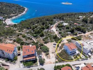 an aerial view of a house with a yellow circle at Villa Fio - Rooms & Studio in Hvar +37 photos