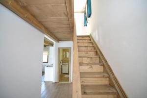 a staircase in a house with wooden floors at Filipa River House Ada Bojana in Ulcinj