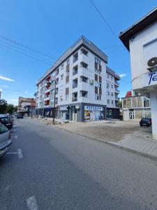 an empty street in front of a building at Bojana Apartment Penthouse in Negotino