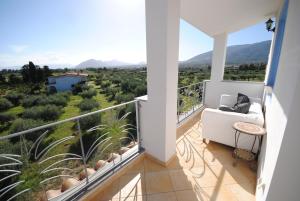 a balcony with a view of a valley and mountains at Holiday Residence Rifugio in Orosei