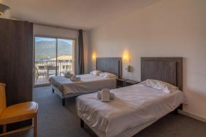Postel nebo postele na pokoji v ubytování Hotel Hibiscus