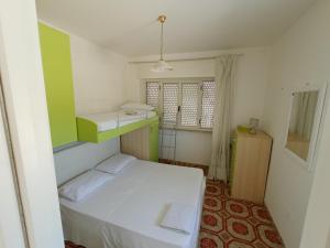 Postel nebo postele na pokoji v ubytování Mamalina Residence