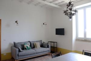 a living room with a couch and a table at Agriturismo Morani in Santa Severa