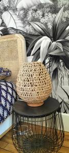 a basket sitting on a table next to a chair at Nancy Gare Centre Parking in Nancy