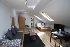 a living room with a couch and a table at Westciti Croydon Serviced Apartments in Croydon