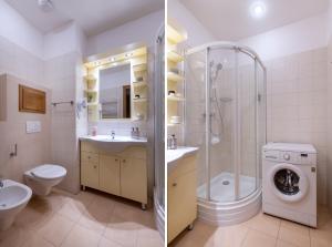 a bathroom with a shower sink and a washing machine at Bohemian Dreams Apartments and Suites in Prague