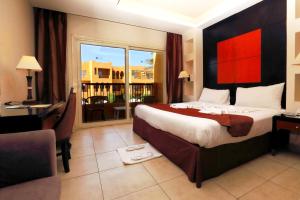 A bed or beds in a room at Rehana Royal Beach Resort - Aquapark & Spa - Family & Couples Only - Premium Ultra All-Inclusive 24H
