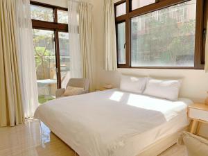 Ένα ή περισσότερα κρεβάτια σε δωμάτιο στο 光域文旅