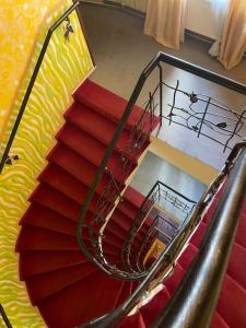 an overhead view of a spiral staircase in a building at Gallery Hotel SIS in Prague