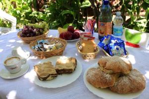 a table with bread and pastries and a cup of coffee at Villa Lembo in Agnone