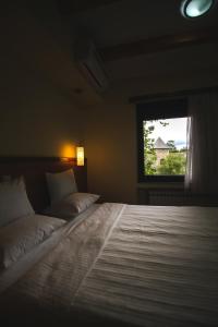 Postel nebo postele na pokoji v ubytování Hotel Vila Vrbas