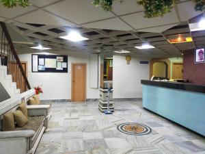 a lobby of a hospital with a reception desk at Hotel Kartiki in Aurangabad
