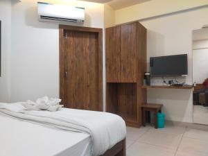 Hotel Kartiki客房内的一张或多张床位