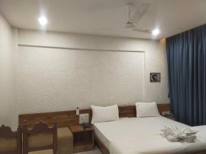 Hotel Kartiki客房内的一张或多张床位