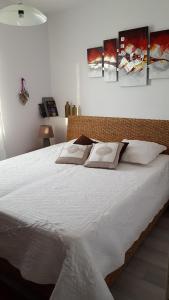 Postel nebo postele na pokoji v ubytování L'Olivier