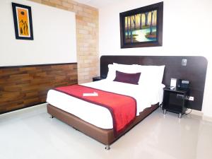 Ένα ή περισσότερα κρεβάτια σε δωμάτιο στο Hotel Acqua Medellín