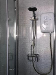 a shower head in a bathroom with a showeroser at Welsh Getaway Home No 1 - 10 mins to Bike Park Wales in Merthyr Tydfil