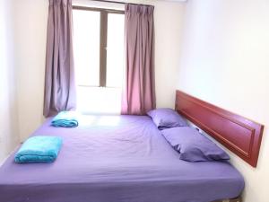 Giường trong phòng chung tại Pangkor Coral Bay Resort(3 bedrooms) 休息小站