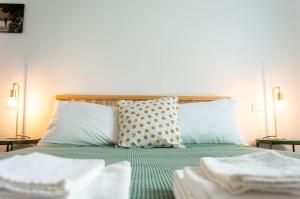 A bed or beds in a room at La Silvana B&B