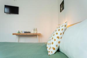 A bed or beds in a room at La Silvana B&B