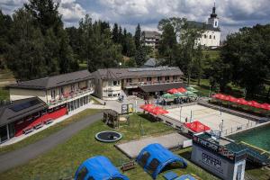 an aerial view of a building with a tennis court at Penzion Acrobat Park in Štíty